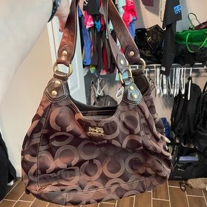 Authentic Brown Coach bag with center zip compartment with purple lining